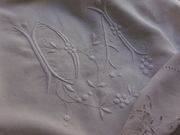 white embroidered monogram DA